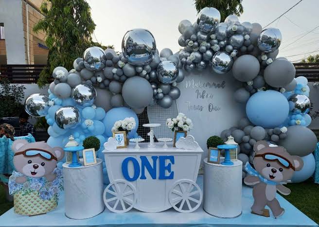 Milestone birthday celebration décor with custom signage